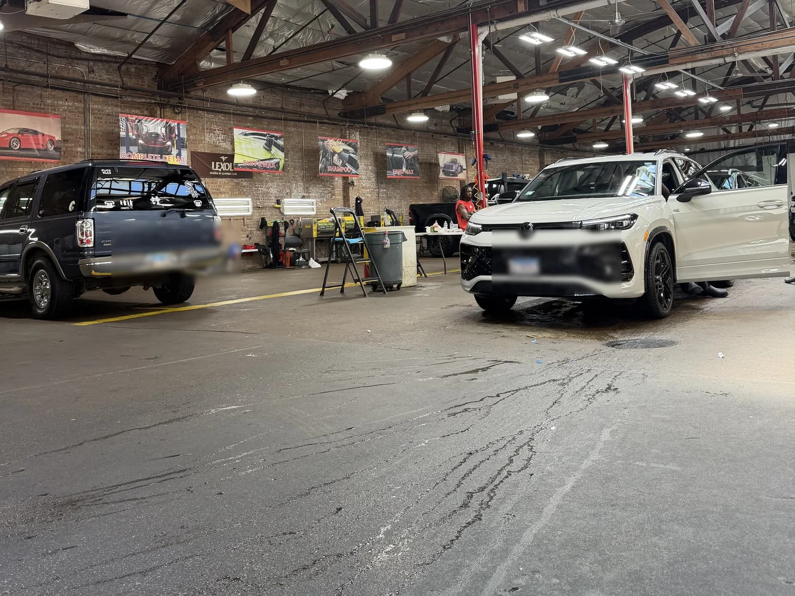 Vehicles in the South Loop wash bay during exterior hand wash service